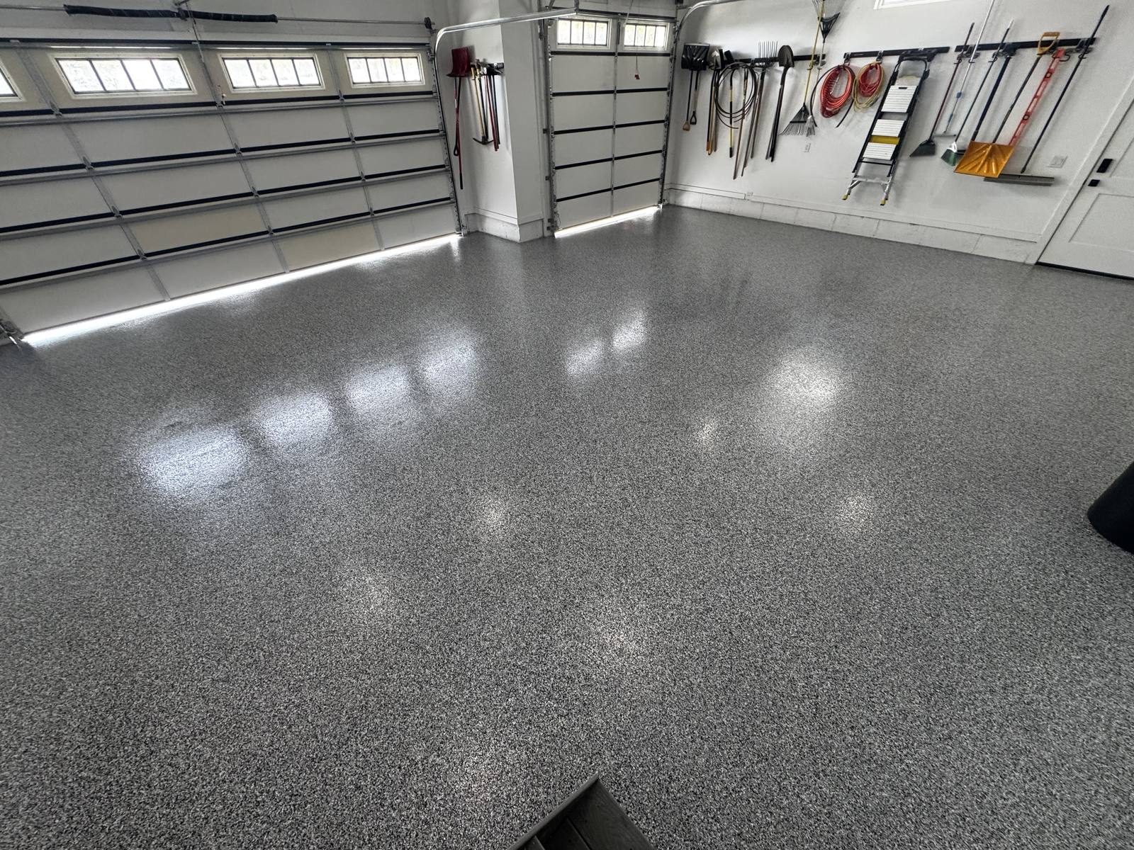 Finished flake garage floor coating in a bright Cache Valley garage