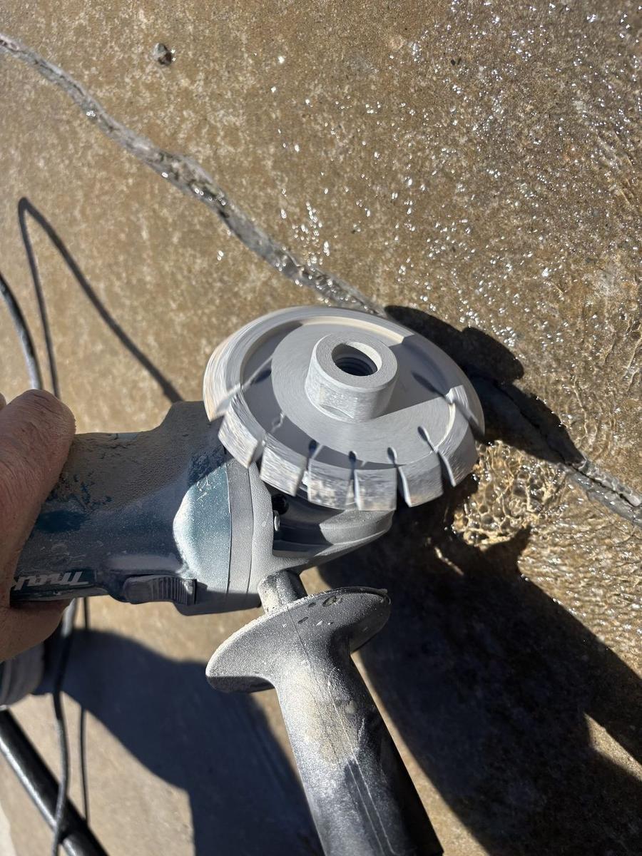 Chasing a crack with a grinder before sealing